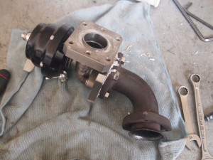 Tial F38 wastegate fitted with adapter plates and Porsche 944 Turbo crossover to wastegate pipe